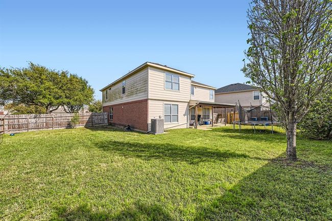 Covered Back Porch In The Large Fully Fenced Backyard | Image 28