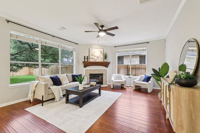 A bright and airy living room perfect for both quiet mornings and vibrant entertaining. | Image 4