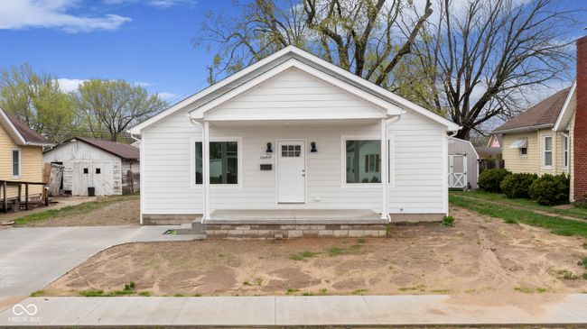 bungalow-style house featuring a storage shed and an outdoor structure | Image 6