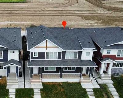 225 Creekside Dr Sw, Home with 4 bedrooms, 3 bathrooms and 2 parking in Calgary AB | Image 2