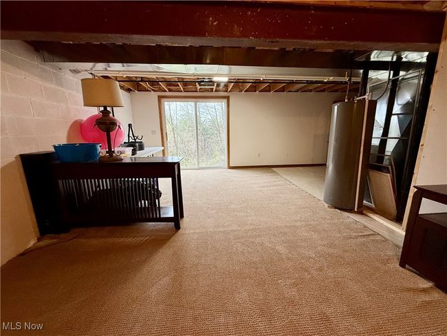 Basement featuring gas water heater and light carpet | Image 33