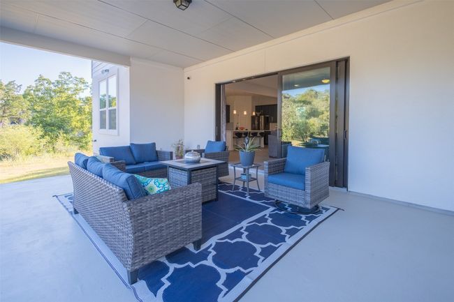 Enjoy the fall weather on your oversized covered patio while enjoying your favorite beverage. | Image 29
