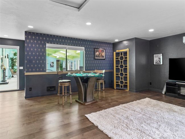 Views of the rec/game room with pool access | Image 23