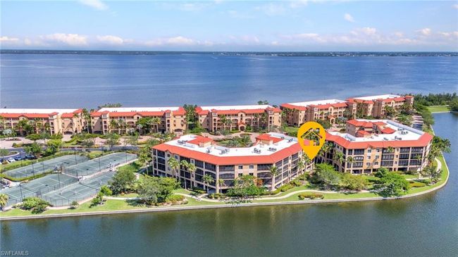 Aerial view of apartment complex / building and a large body of water | Image 4
