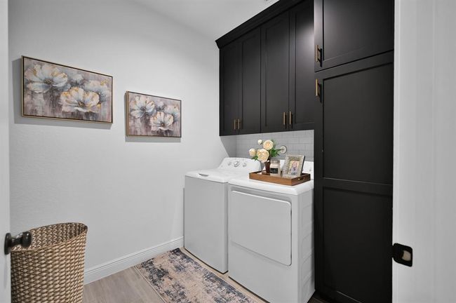 Laundry room with custom built-ins. | Image 31