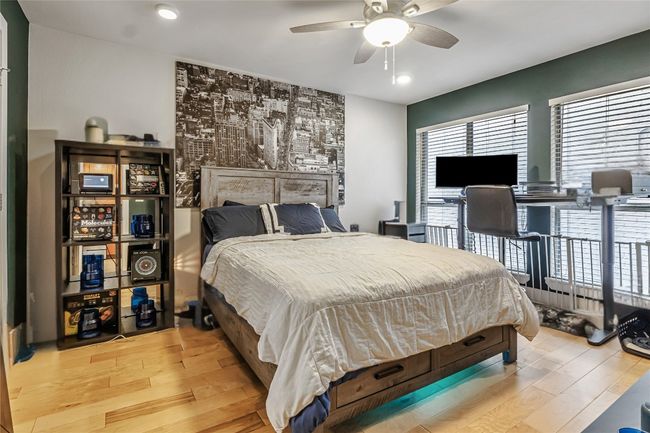 Bedroom with light wood finished floors, recessed lighting, and a ceiling fan | Image 7