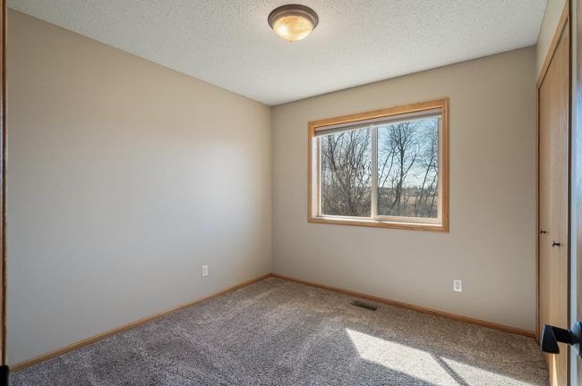 2nd bedroom on the main level facing the backyard. | Image 23