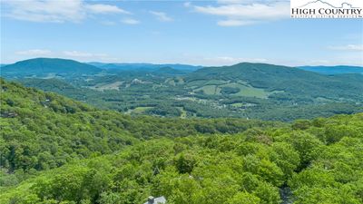 Behold layers of mountains, valleys, and serene woodlands from this stunning property. | Image 3