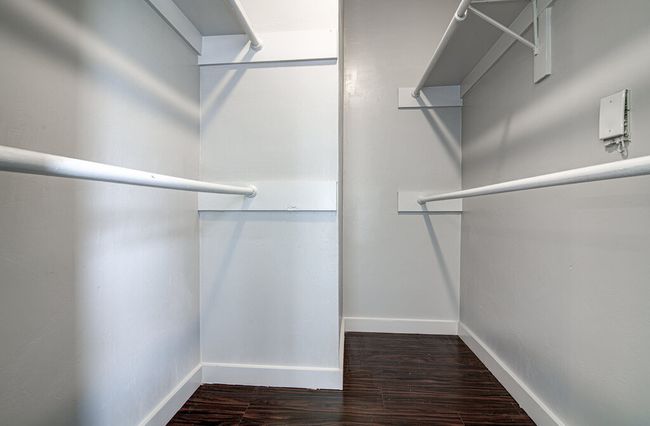 Spacious closet featuring wood finished floors | Image 17