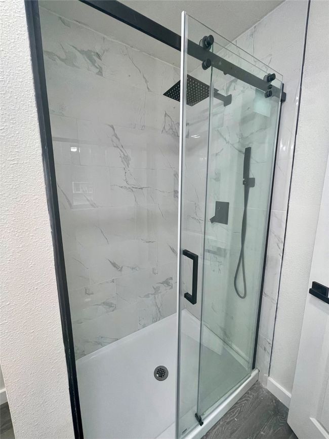 Full bath with a marble finish shower | Image 8