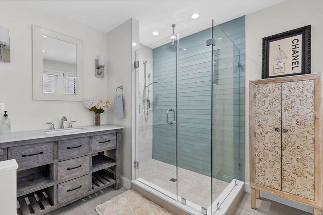 PUpdated Primary Bath with Barn Door and Tile Floors | Image 23