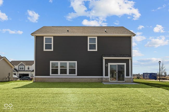 rear view of house with brick siding and a yard | Image 29