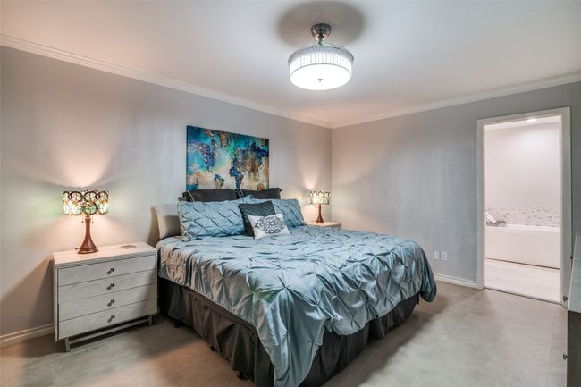 Bedroom featuring crown molding, baseboards, and ensuite bathroom | Image 10