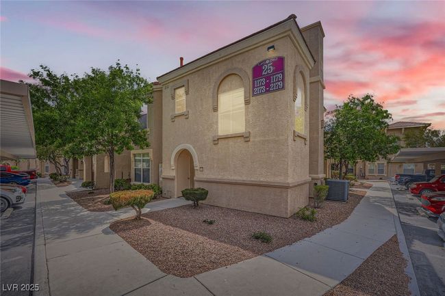 View of front of property featuring stucco siding and central air condition unit | Image 28