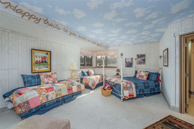 Carpeted bedroom featuring wood walls | Image 34