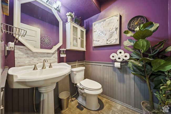 Bathroom with wainscoting and toilet | Image 10
