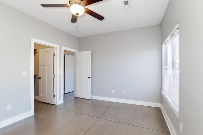 Unfurnished bedroom with ceiling fan | Image 19
