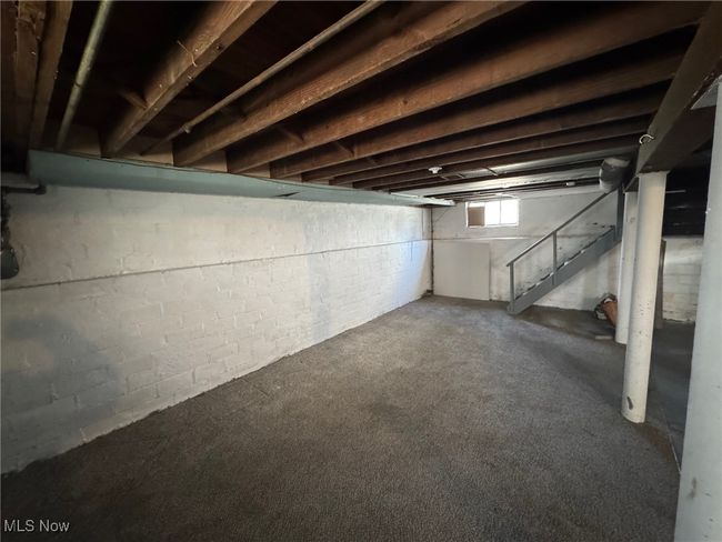 Basement with carpet flooring and stairs | Image 16