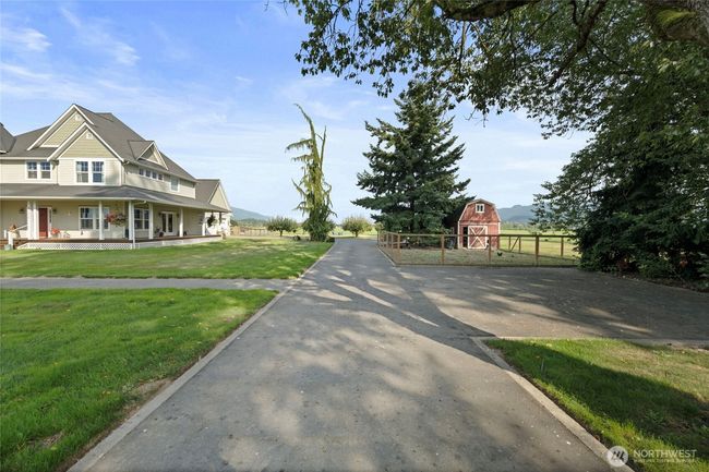 Paved drive with plenty of parking for guests or RV | Image 35
