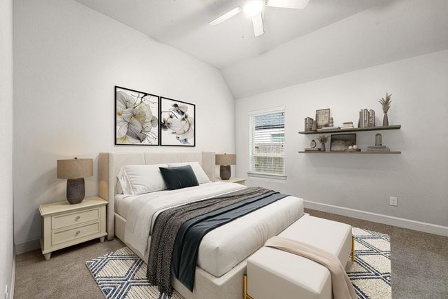 Secondary bedroom features plush carpet, neutral paint, ceiling fan with lighting and a large window with privacy blinds. *virtual staged* | Image 13