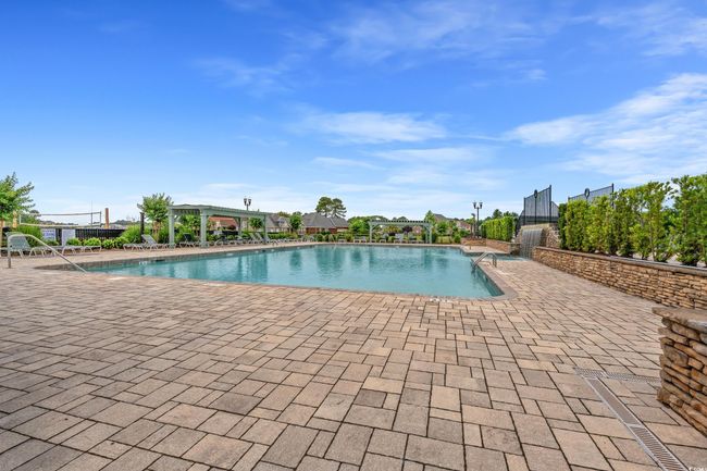 Community pool with a patio area | Image 15
