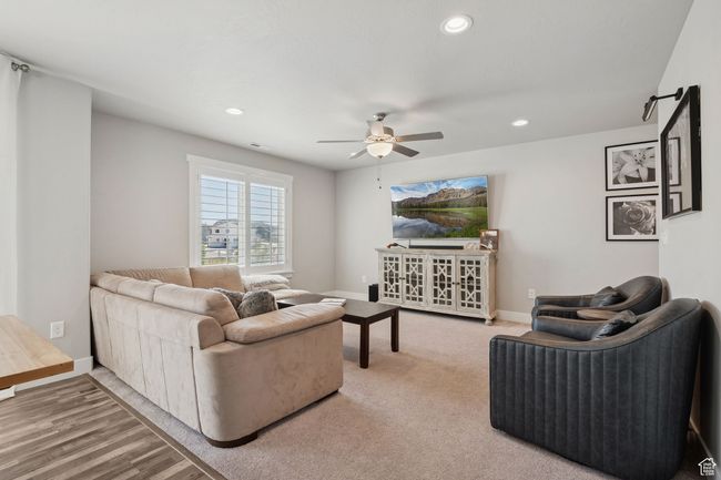 Living area with ceiling fan and recessed lighting | Image 7