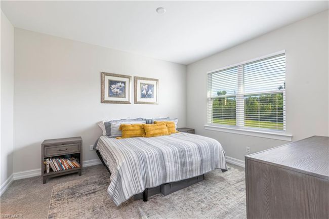 Bedroom with light carpet and baseboards | Image 12