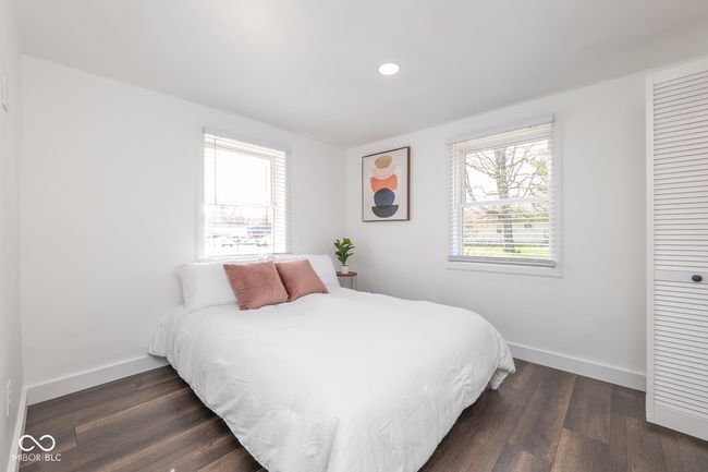 bedroom featuring recessed lighting, dark wood finished floors, baseboards, and multiple windows | Image 16