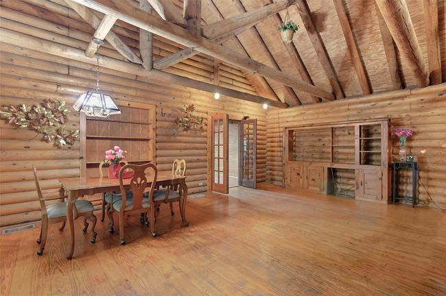 Enter into the dining and family room with soaring ceilings. | Image 4