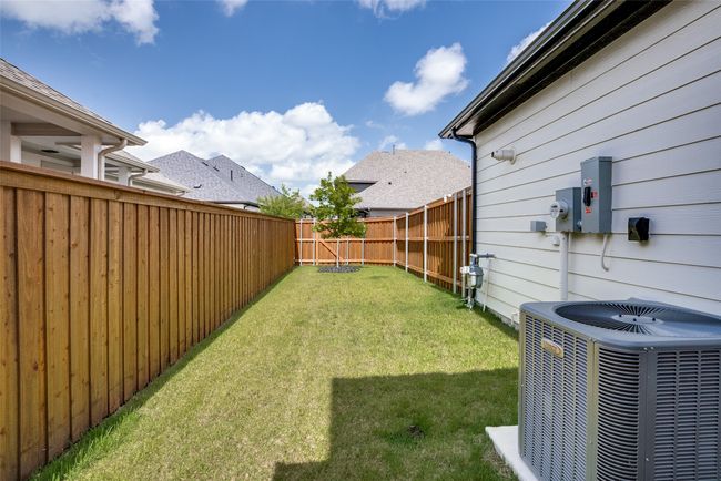 View of fenced backyard | Image 28