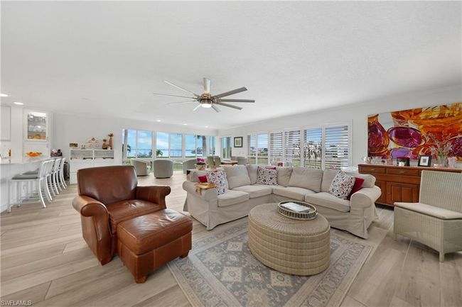Living room featuring ceiling fan and light wood-type flooring | Image 14
