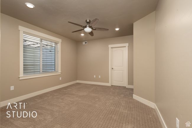 Unfurnished room with ceiling fan, carpet flooring, and recessed lighting | Image 28