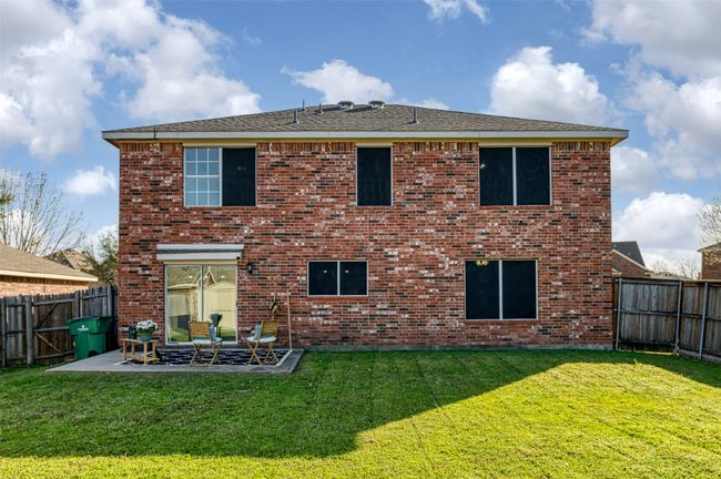 Back of house with a patio area, a yard, and a fenced backyard | Image 32