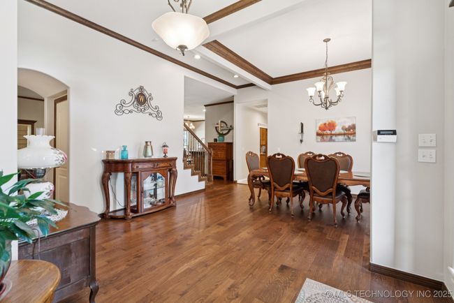 Entertain in this large formal dining with lots of light, hardwood floors and crown molding | Image 6