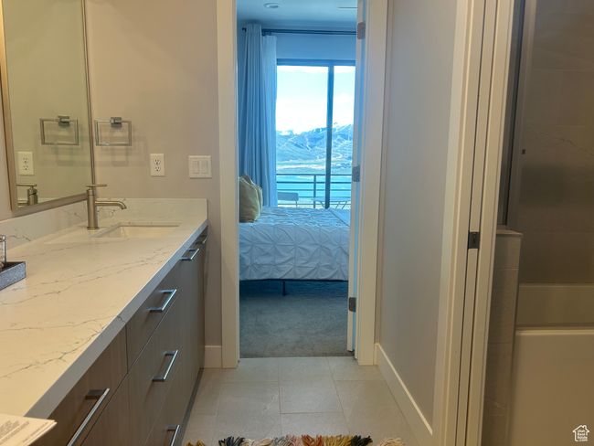 2 bedroom have direct access to the bathroom with vanity and baseboards | Image 27