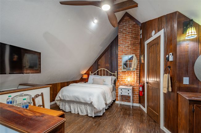 The Attic suite features handscraped hardwood floors, custom private bathroom with walk-in shower, smart TV, full size bed and an XL Twin bed in loft | Image 34