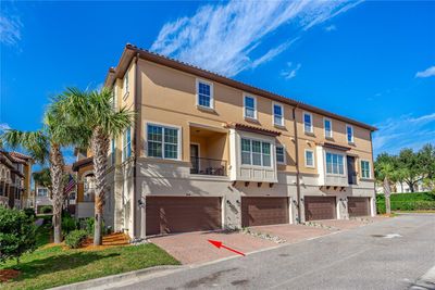 End unit with paver driveway deep enough to fit a compact car | Image 3