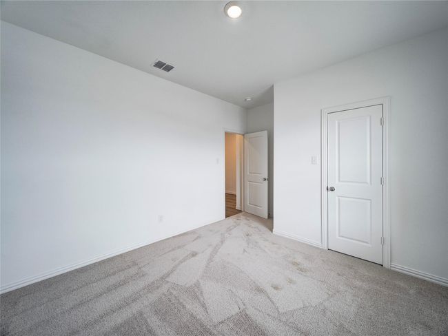 Unfurnished bedroom with carpet flooring and baseboards | Image 31