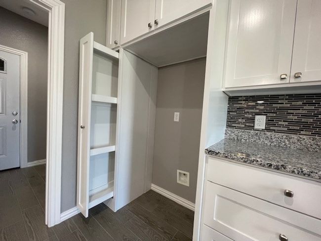 Kitchen with custom pullout storage next to fridge | Image 13