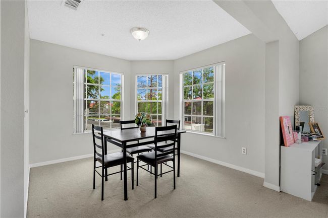 Dining room with windows facing a SW direction | Image 8