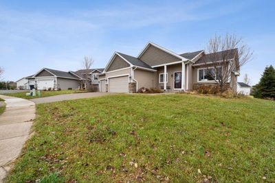 Front of the property with 3-Car garage and porch at an angle. | Image 2