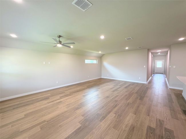 Unfurnished room featuring light wood-style flooring, recessed lighting, baseboards, and ceiling fan | Image 11