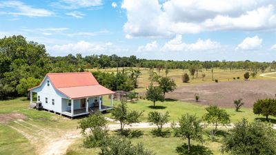 Looking at the east, southeast end of the property, toward the home, rv hookups, detached garage/shop/storage building. **Lines are estimates only, not indicative of actual property lines. | Image 2