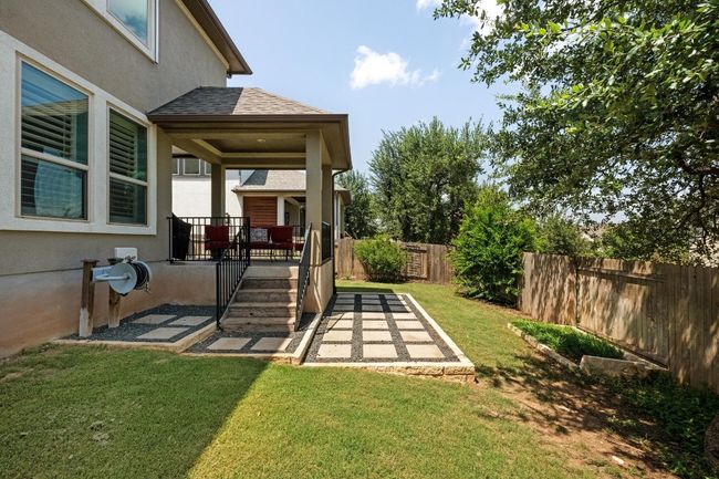 Fenced yard with covered porch; great for entertaining guests | Image 35