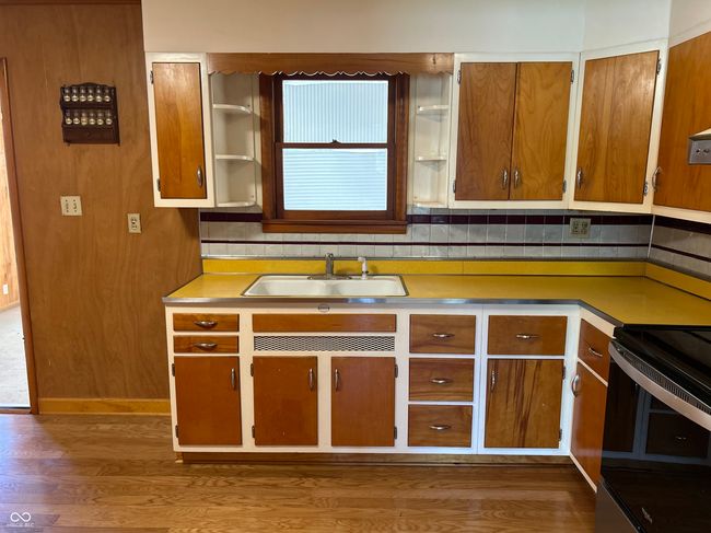 Original formica counter w/stainless steel edging, maple cabinets. | Image 15