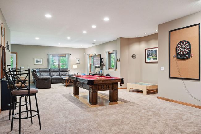 Lounge, play games, and entertain, in this expansive rec room. | Image 21