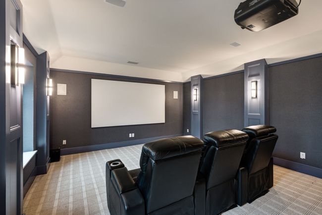 Cinema featuring light carpet and baseboards | Image 26