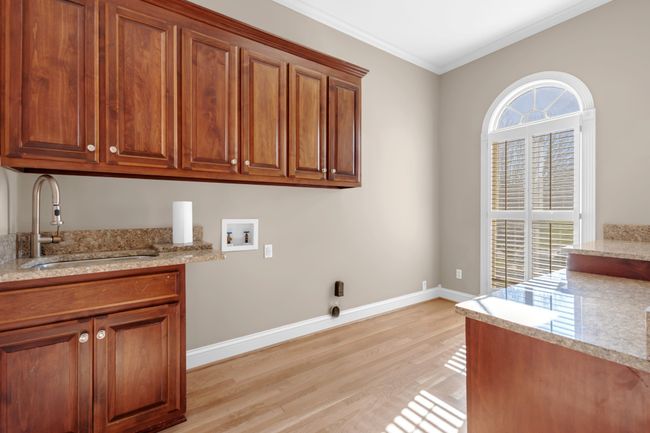 laundry with lot of storage cabinets and hook ups | Image 29