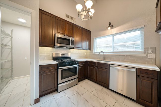 Kitchen with access to walkin pantry for lots of storage | Image 10
