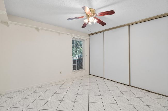 Spare room with a textured ceiling and a ceiling fan | Image 25